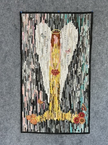 Angel wall hanging by Michele Urbany Neely Puluti with a golden figure, halo, flowers, birds, and cascading gray, white, pink, and turquoise strips