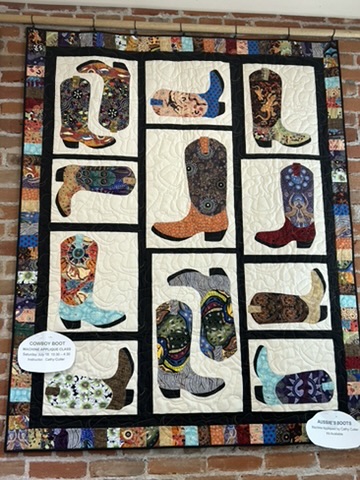 Full display view of Michele Urbany Neely Puluti’s Cowboy Boots Quilt with individually patterned boot blocks