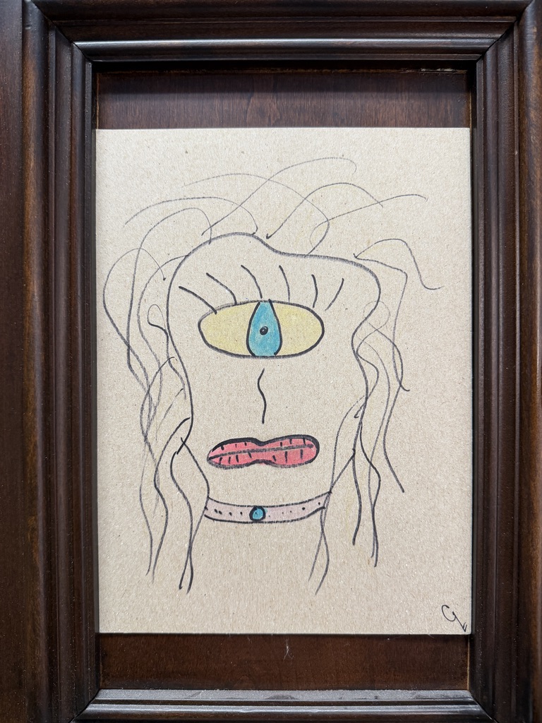 Original one-eyed portrait artwork by Whit in a dark wood frame